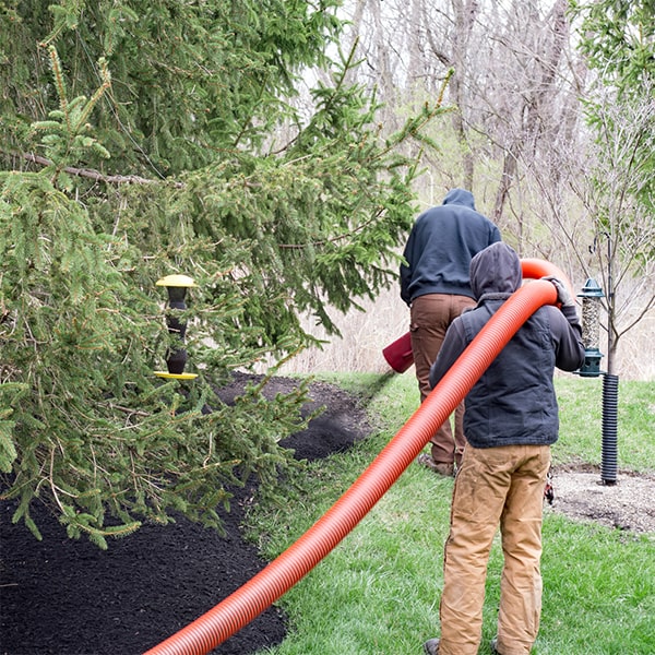 mulch blowing utilizes specialized equipment such as high-powered blowers and hoses for even distribution of mulch